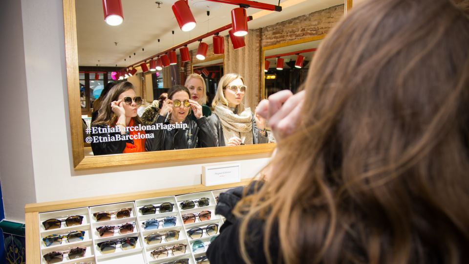 Women trying sunglasses at the shop Etnia Barcelona Women trying sunglasses at the shop Etnia Barcelona